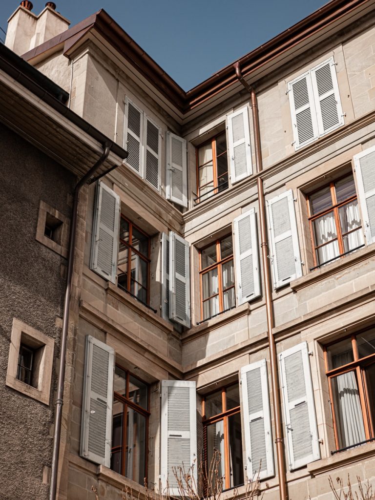 brown concrete building with windows